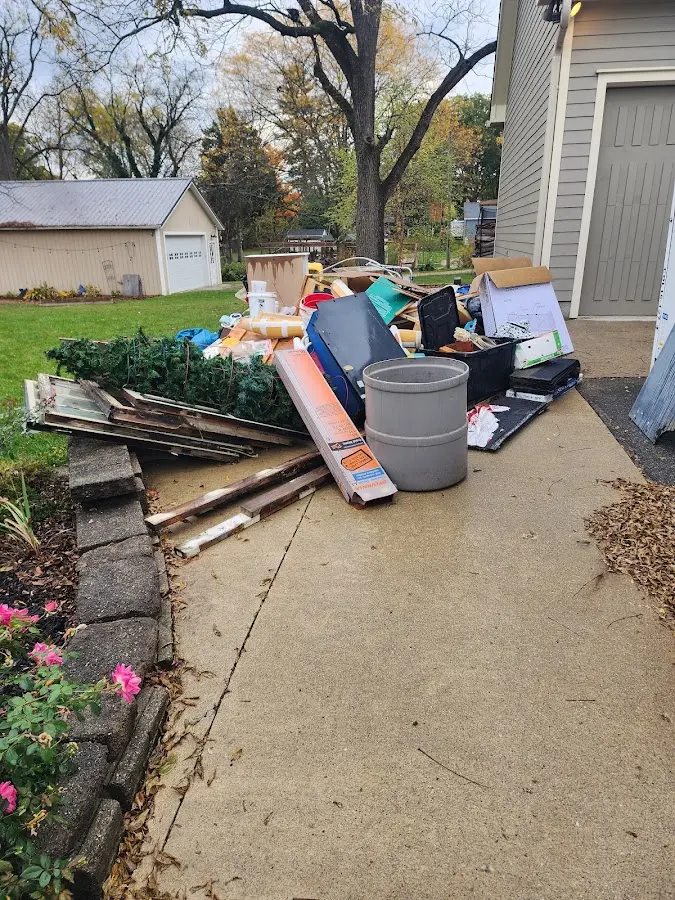 Dumpster being loaded with debris for Roofing Dumpster Rental in Chillicothe